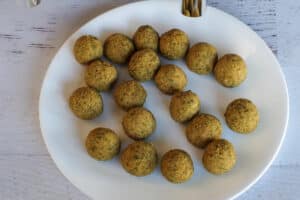 falafel mix formed into balls on white plate