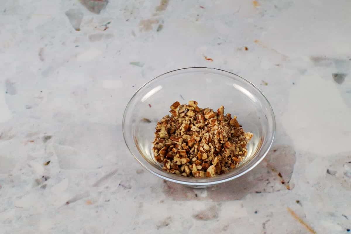 chopped pecans in a small glass bowl