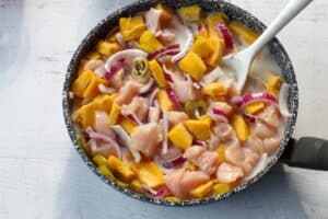 Coconut milk with onion, pumpkin, chicken and spices added