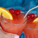 2 glasses of Shirley Temple Mocktails being clinked together