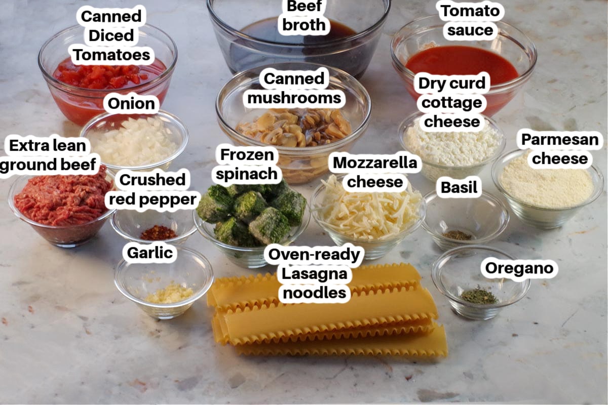 ingredients in slow cooker lasagna soup in glass bowls, labelled