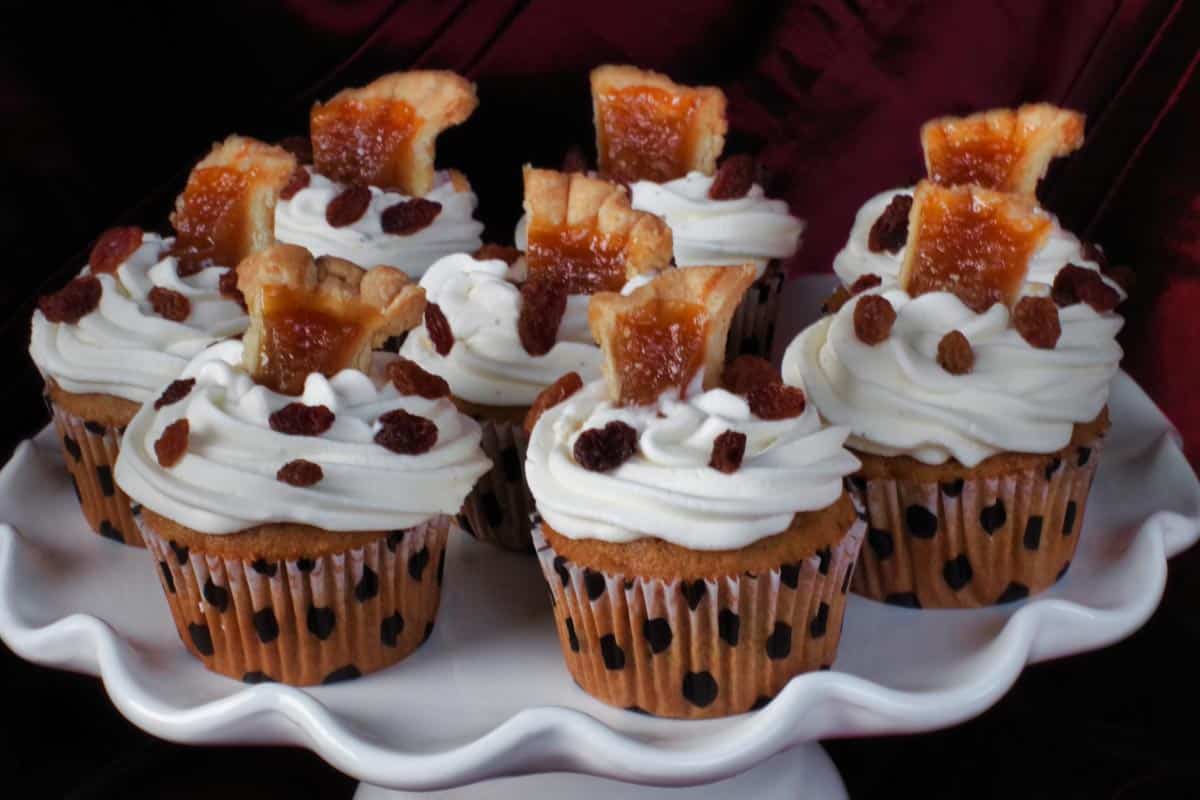 6 butter tart cupcakes on a white cake platter