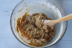 dry ingredients mixed in with wooden spoon