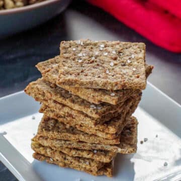 leftover stuffing crackers stacked on a white plate