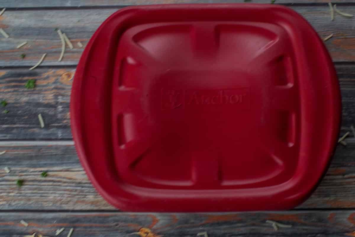 container with red lid