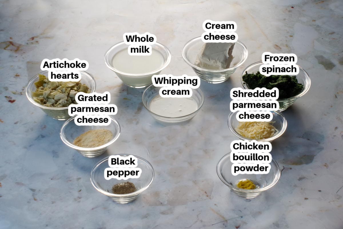 ingredients in spinach artichoke casserole in glass bowls, labelled