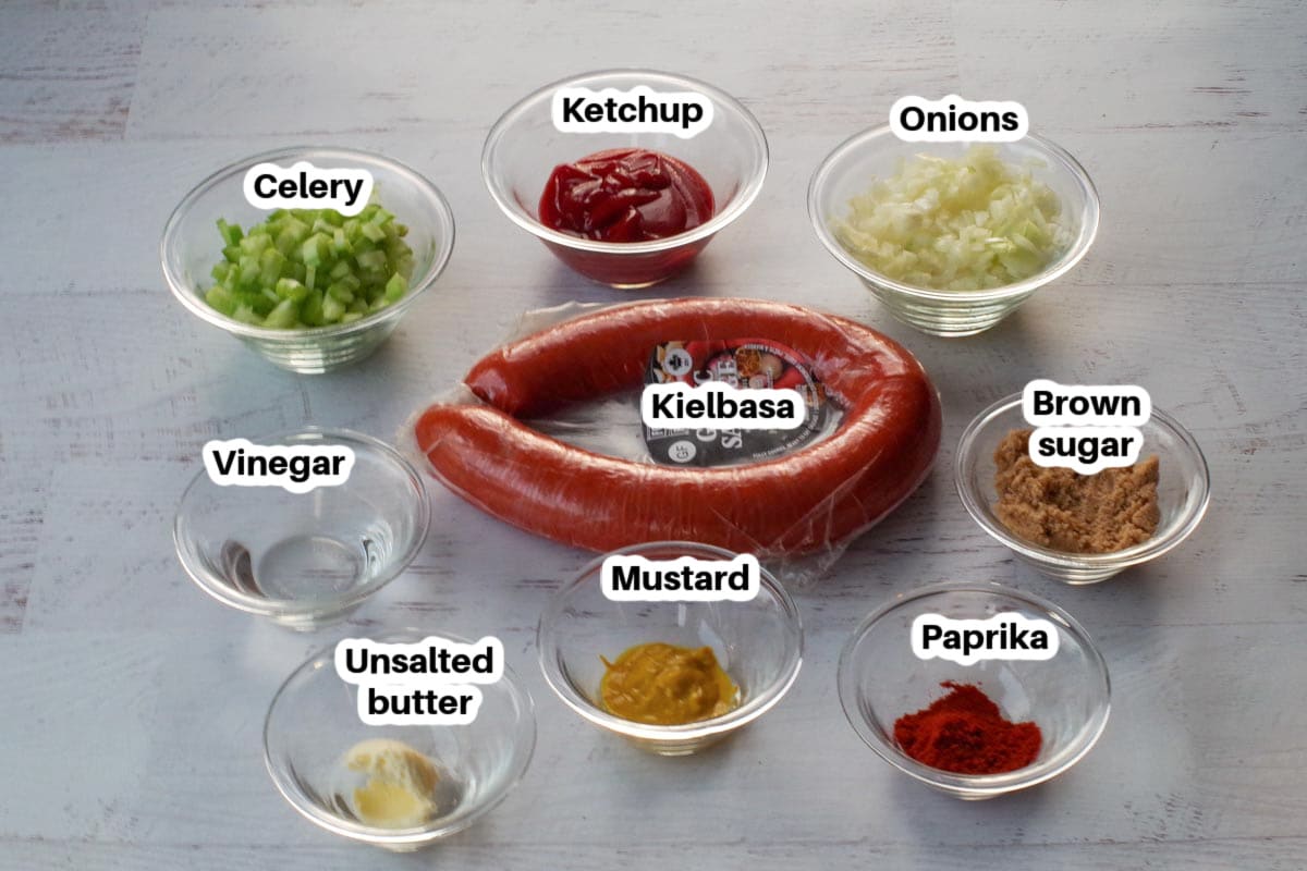 slow cooker kielbasa appetizer ingredients in glass bowls, labelled