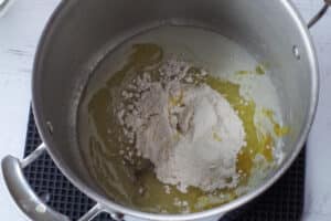 flour, salt, pepper and bouillon added to the pot