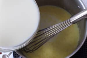 milk being poured into mixture