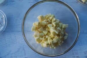diced apples in glass bowl