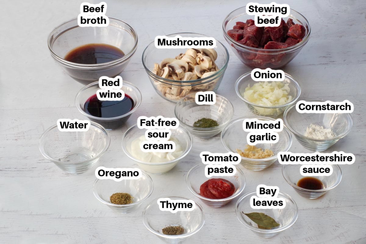 ingredients in light beef stroganoff in glass bowls, labelled