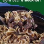 light beef stroganoff being ladled out of slow cooker
