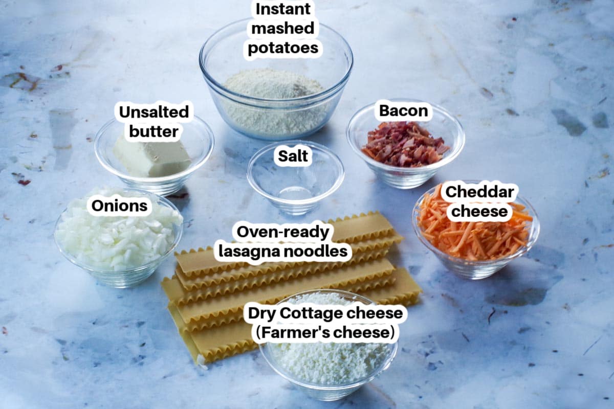 ingredients needed for lazy pierogi in glass dishes with oven -ready lasagna noodles in the middle
