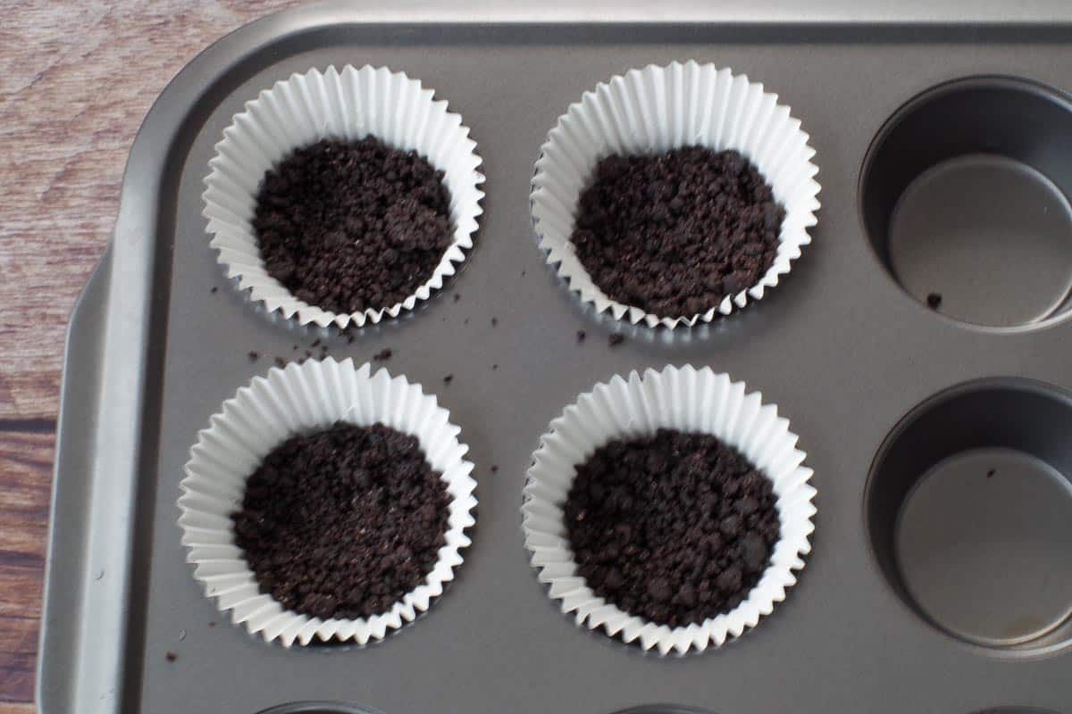 leftover Oreo crust pressed into 4 muffin cups, placed in a muffin tin
