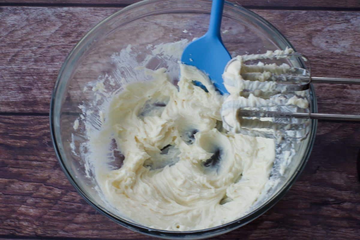 cream cheese beaten together with sugar in a glass bowl