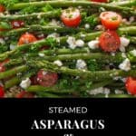 asparagus and tomato salad on a white platter