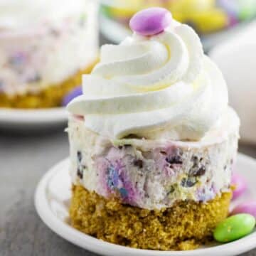 No Bake Mini Easter Cheesecake no a white plate with another in the background