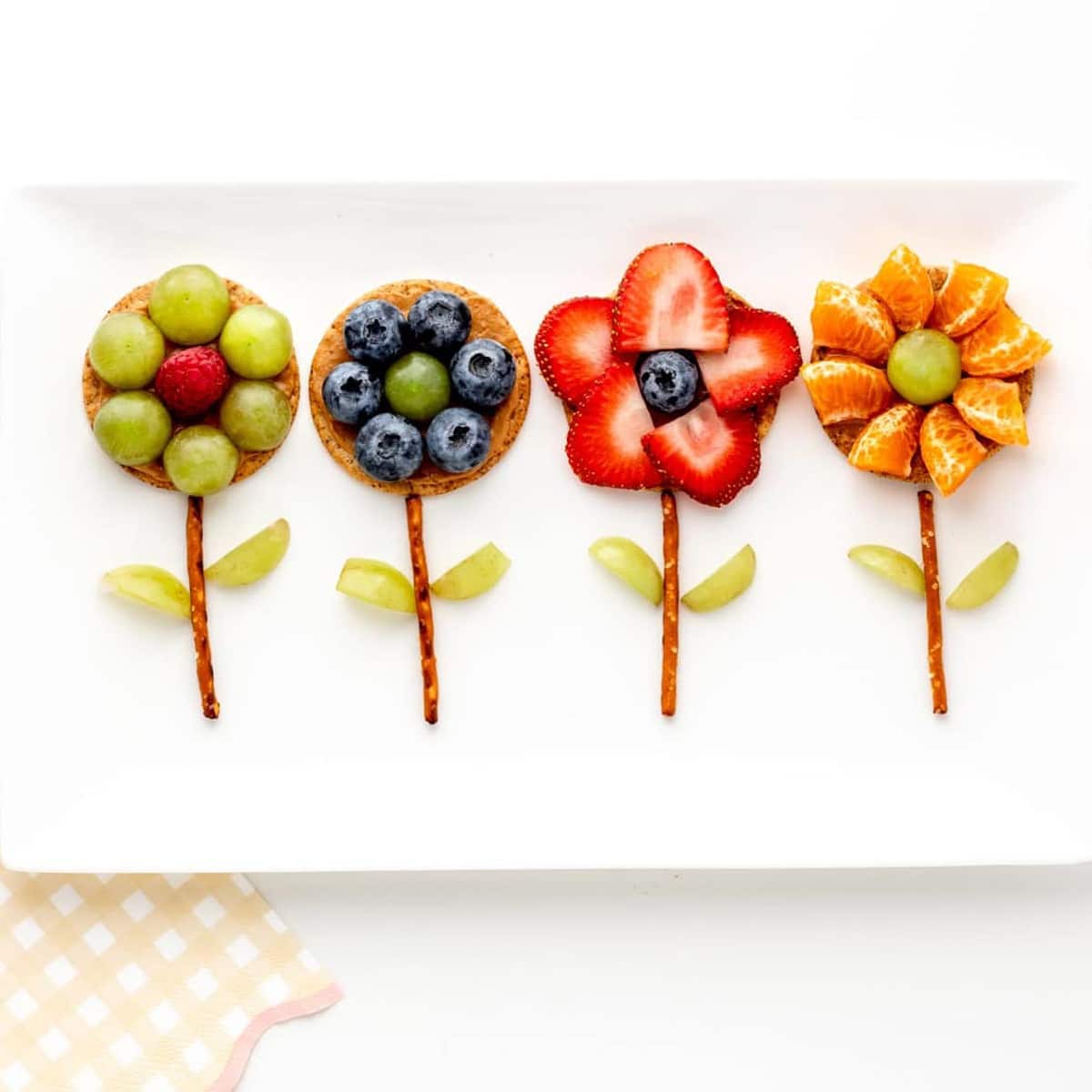 4 flower crackers on a white platter