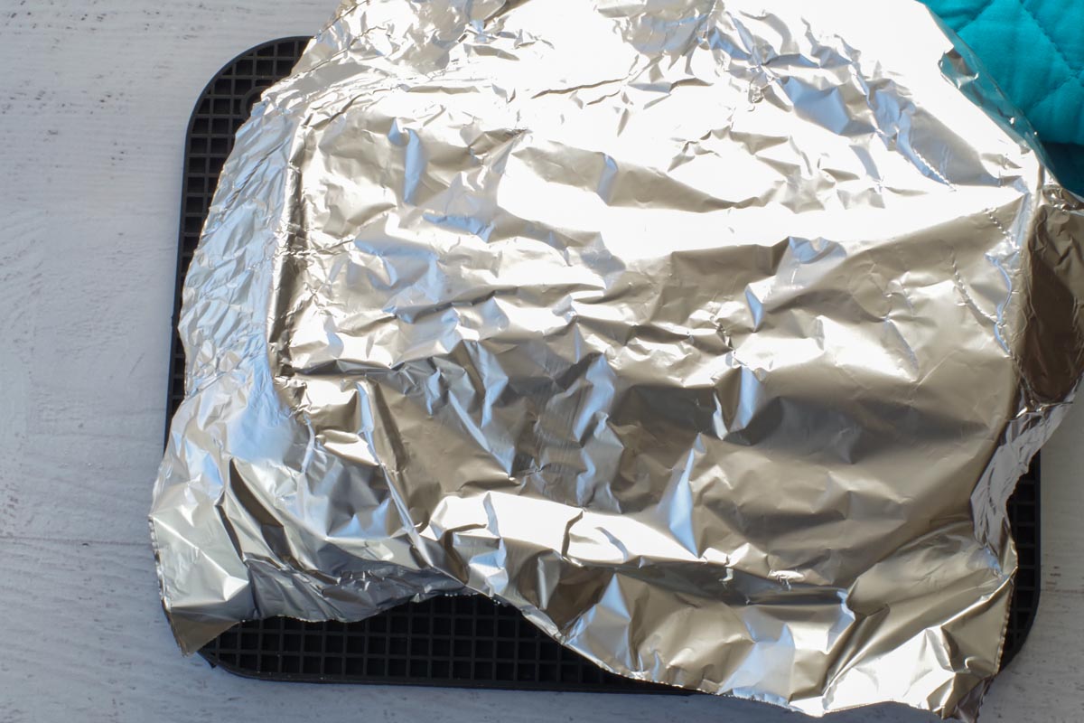 aluminum foil placed loosely over the top of the bread