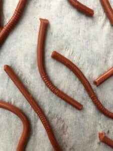 jello worms on parchment paper