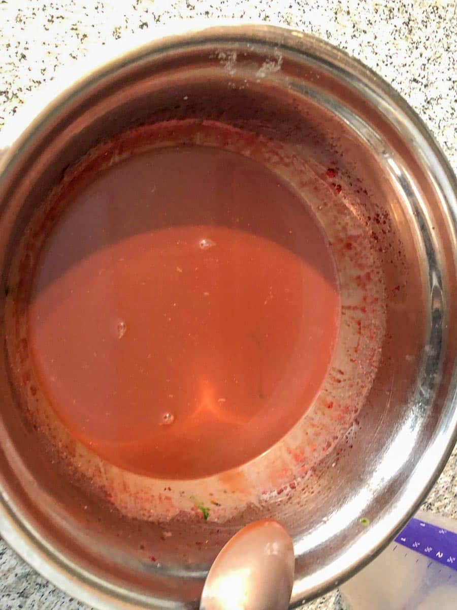 food coloring mixed in until desired color is achieved (in a stainless steel bowl)