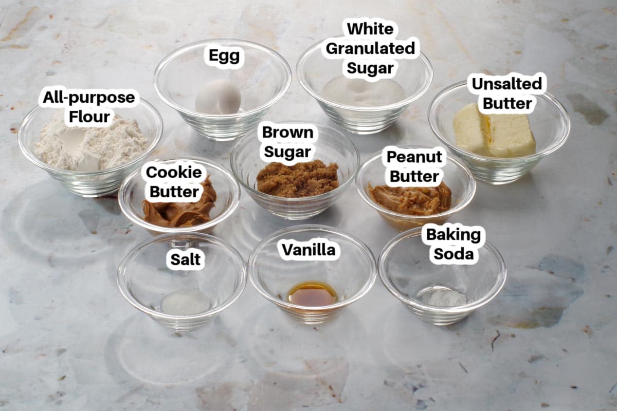 ingredients in peanut butter cookies (with cookie butter) in glass bowls, labelled