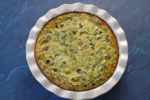 cooked quiche in pie pan