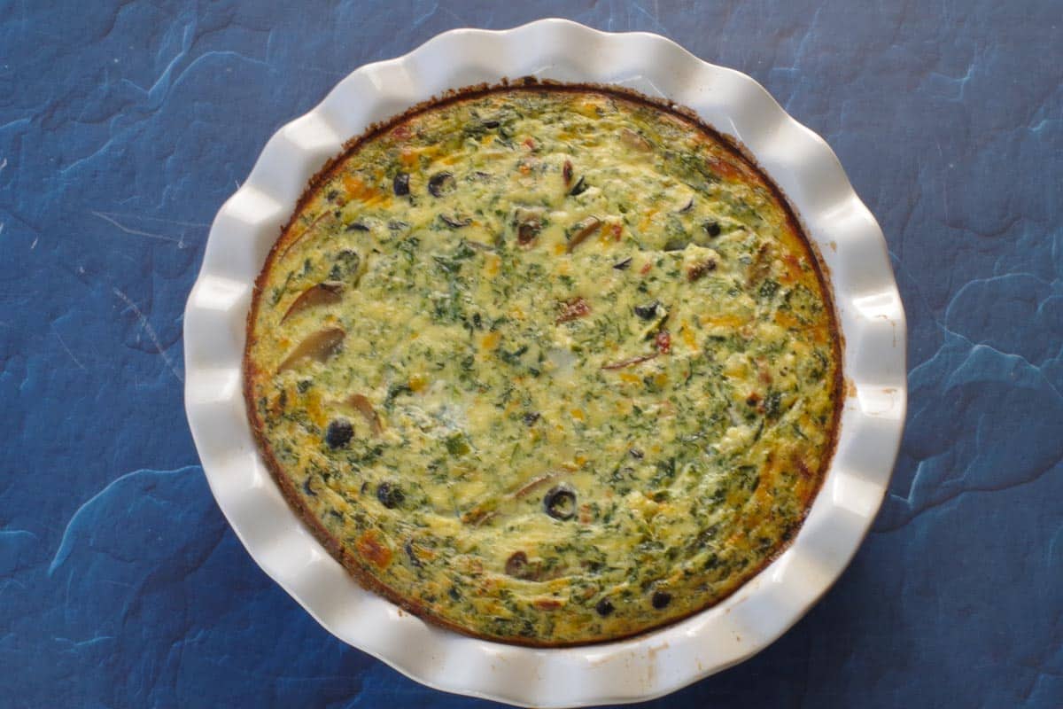 cooked quiche in pie pan
