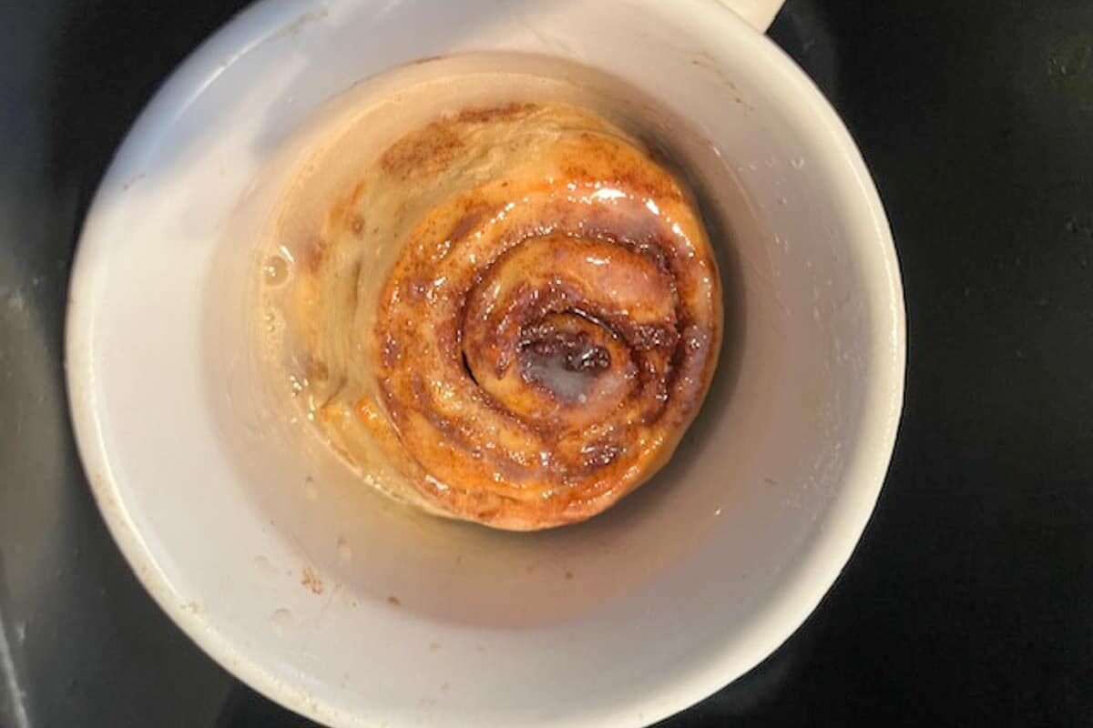 baked cinnamon roll in a meal mug