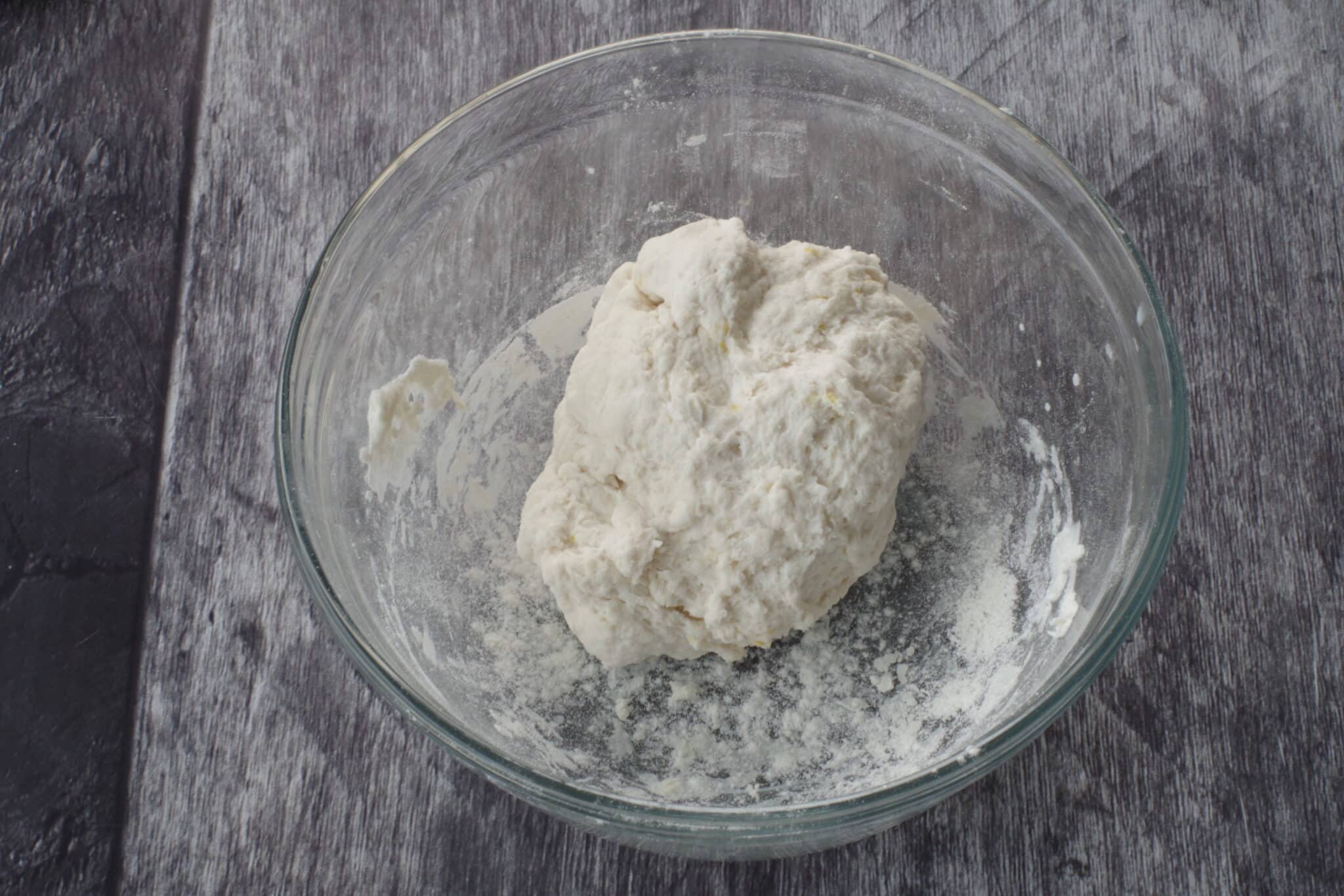 dough mixed together in glass bowl