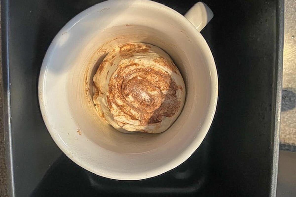 raw cinnamon roll in a meal mug
