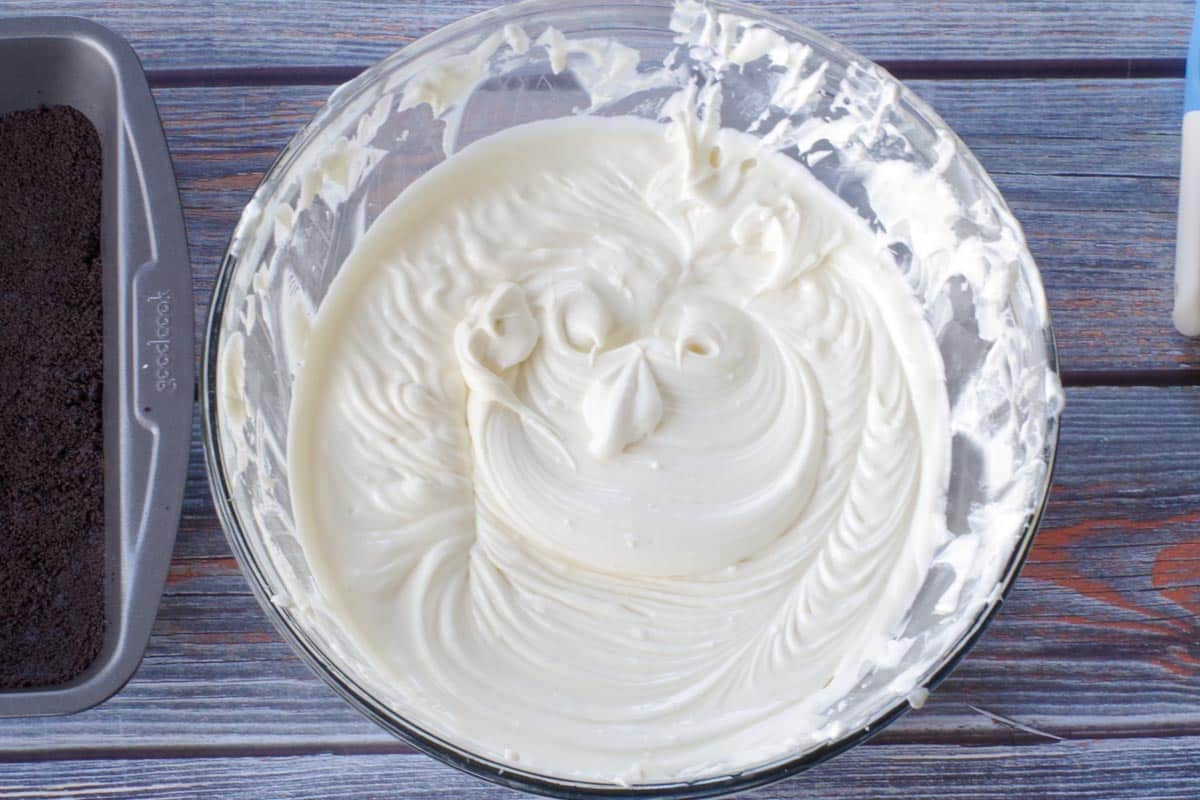 gelatin added to cream cheese mixture in a large glass bowl