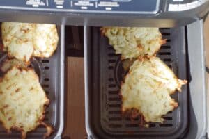 Air fryer potato pancakes flipped over in drawer