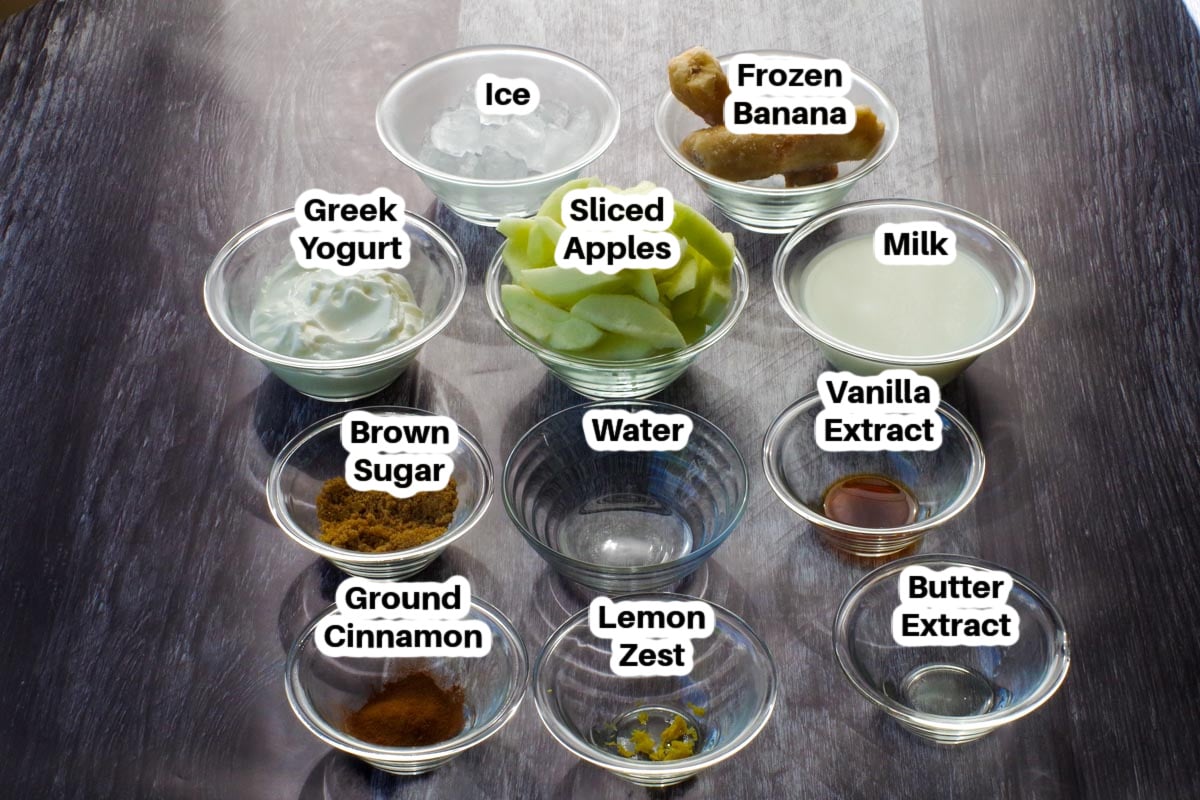 healthy apple pie smoothie ingredients in glass bowls, labelled