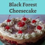 Whole No Bake Black Forest Cheesecake on a turquoise cake stand with text on top