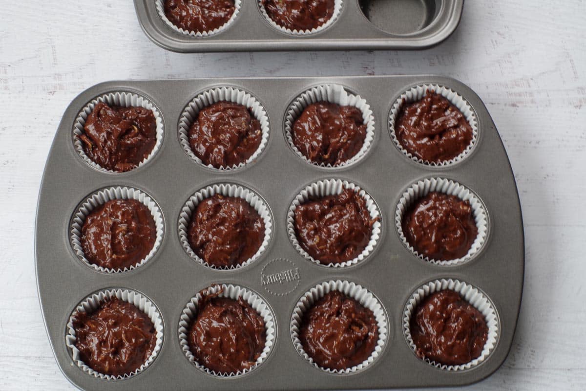 Lined muffin tin filled with batter to ¾ full