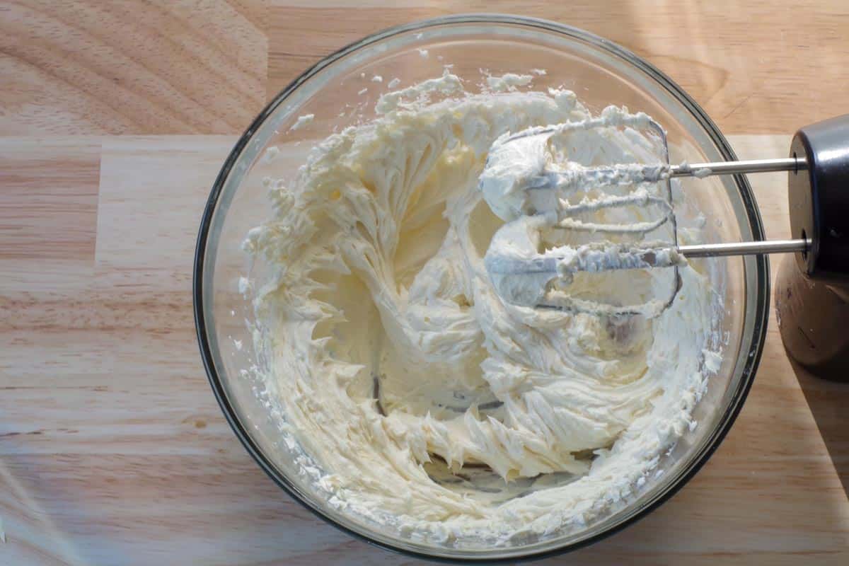 cream cheese and sugar beaten together in a large glass bowl