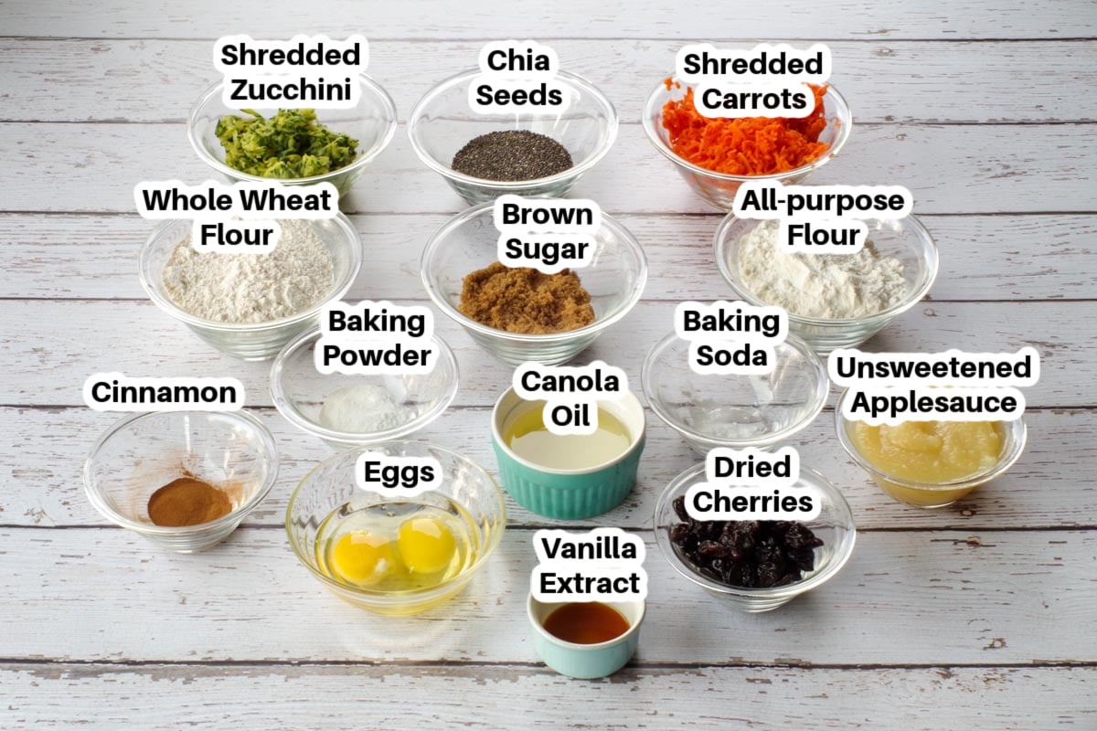 ingredients in healthy zucchini bars in glass bowls, labelled