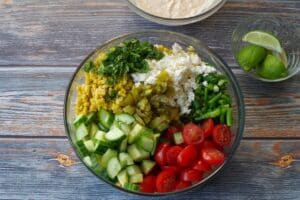 salad ingredients in large glass bowl