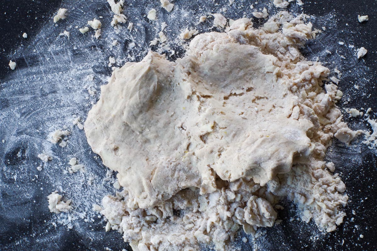 dough with loose flour on cutting board