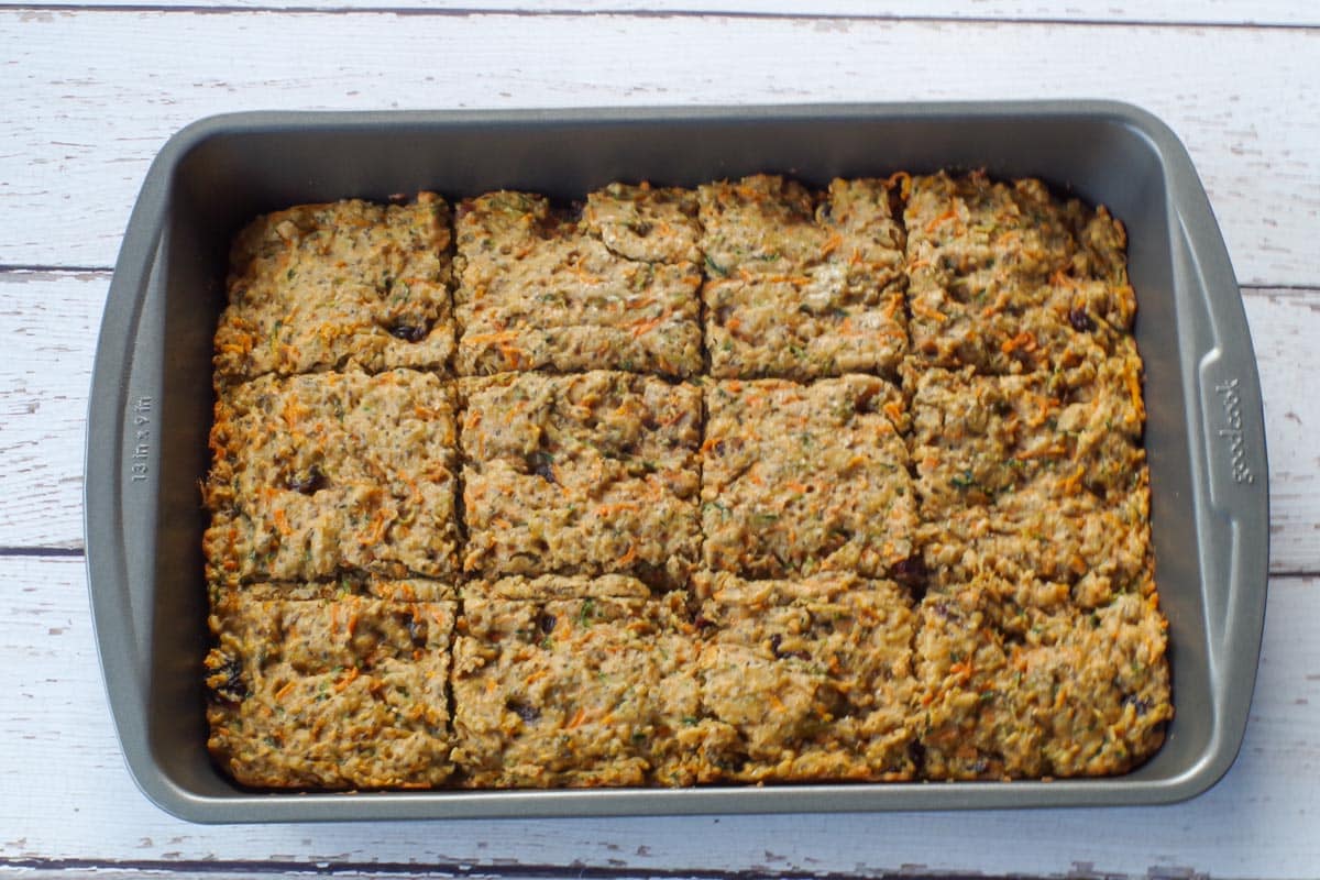 zucchini bars baked and cut into squares, in pan