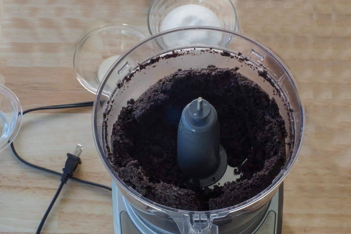 Cheesecake base being made in food processor