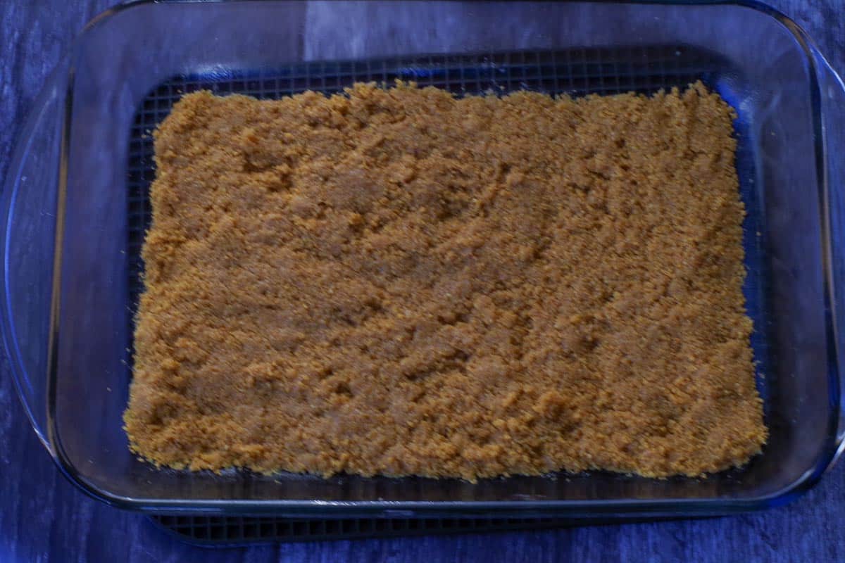 Graham crumb mixture pressed into glass pan