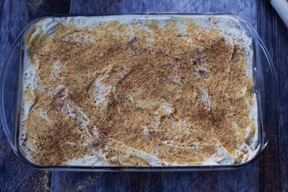 whipped cream spread over pumpkin layer and sprinkled with remaining graham crumbs and cinnamon