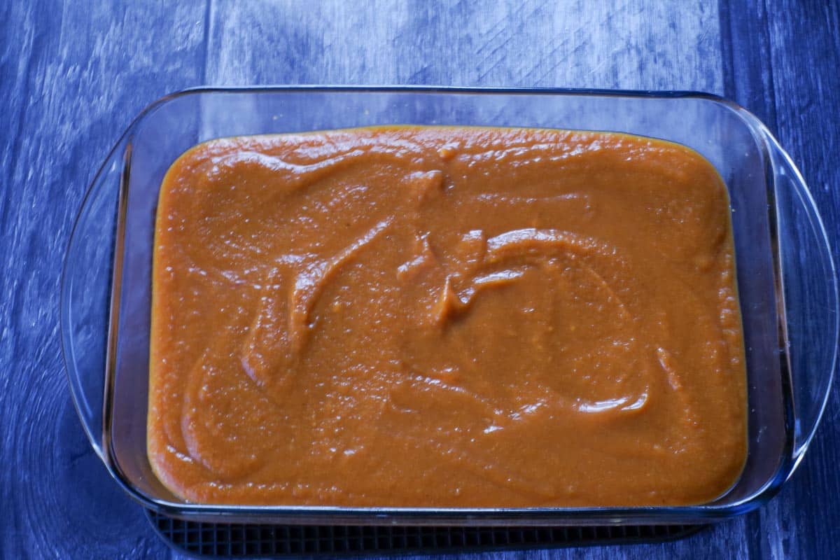 pumpkin mixture poured over graham crust in glass 9X13 pan