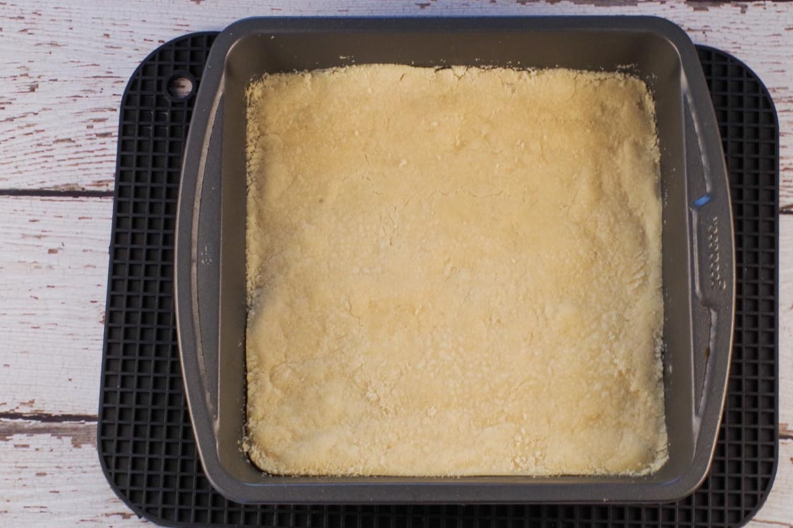 Baked base on large black rectangle trivet.