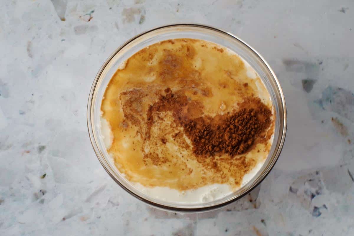 Liquid ingredients in medium glass bowl.