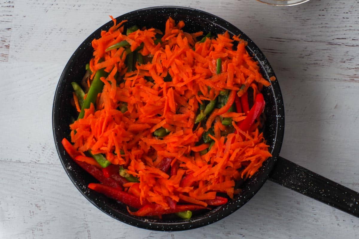 All other ingredients added to pork (except chow mein noodles) in skillet.