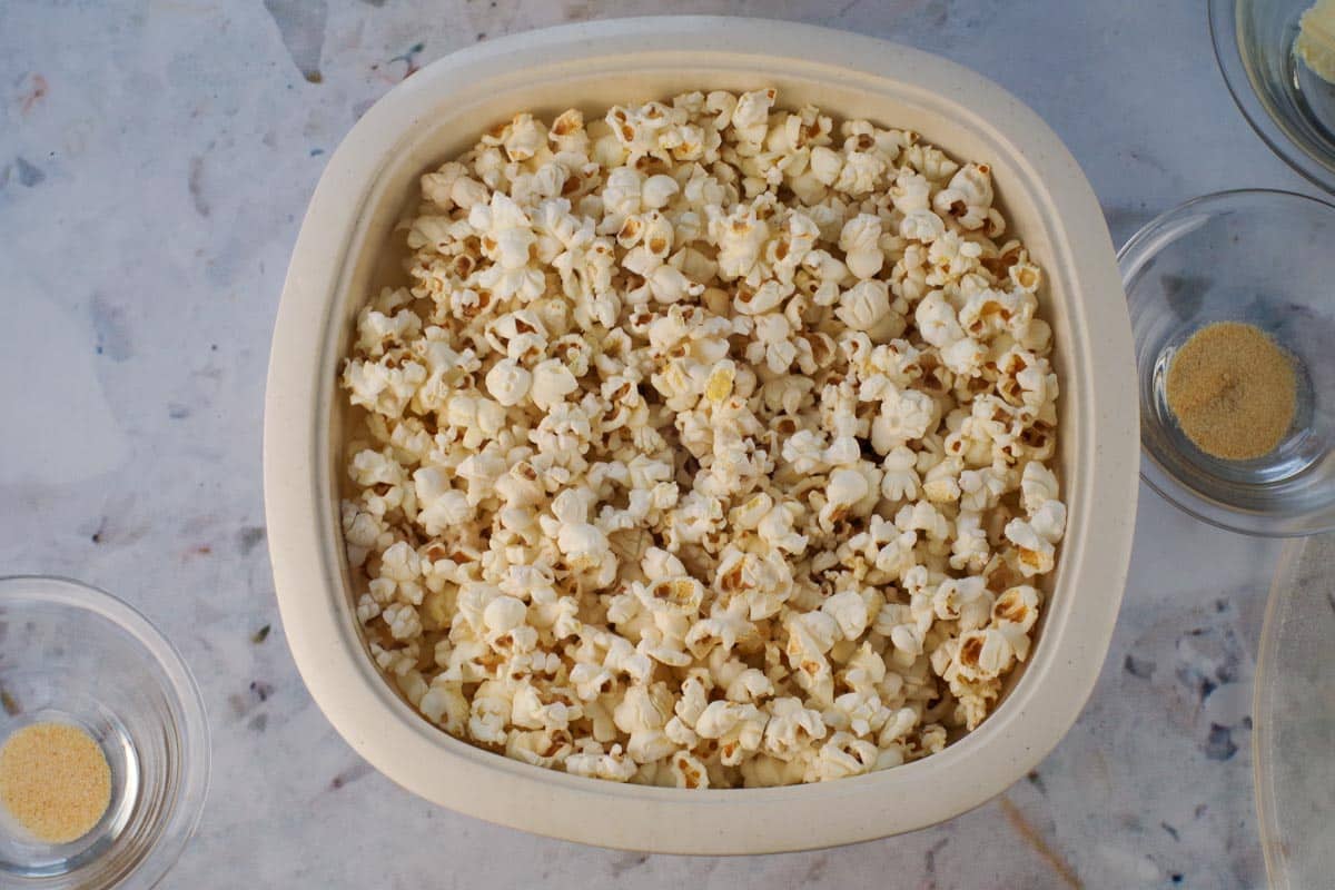 Popcorn kernels popped in microwave popper bowl.