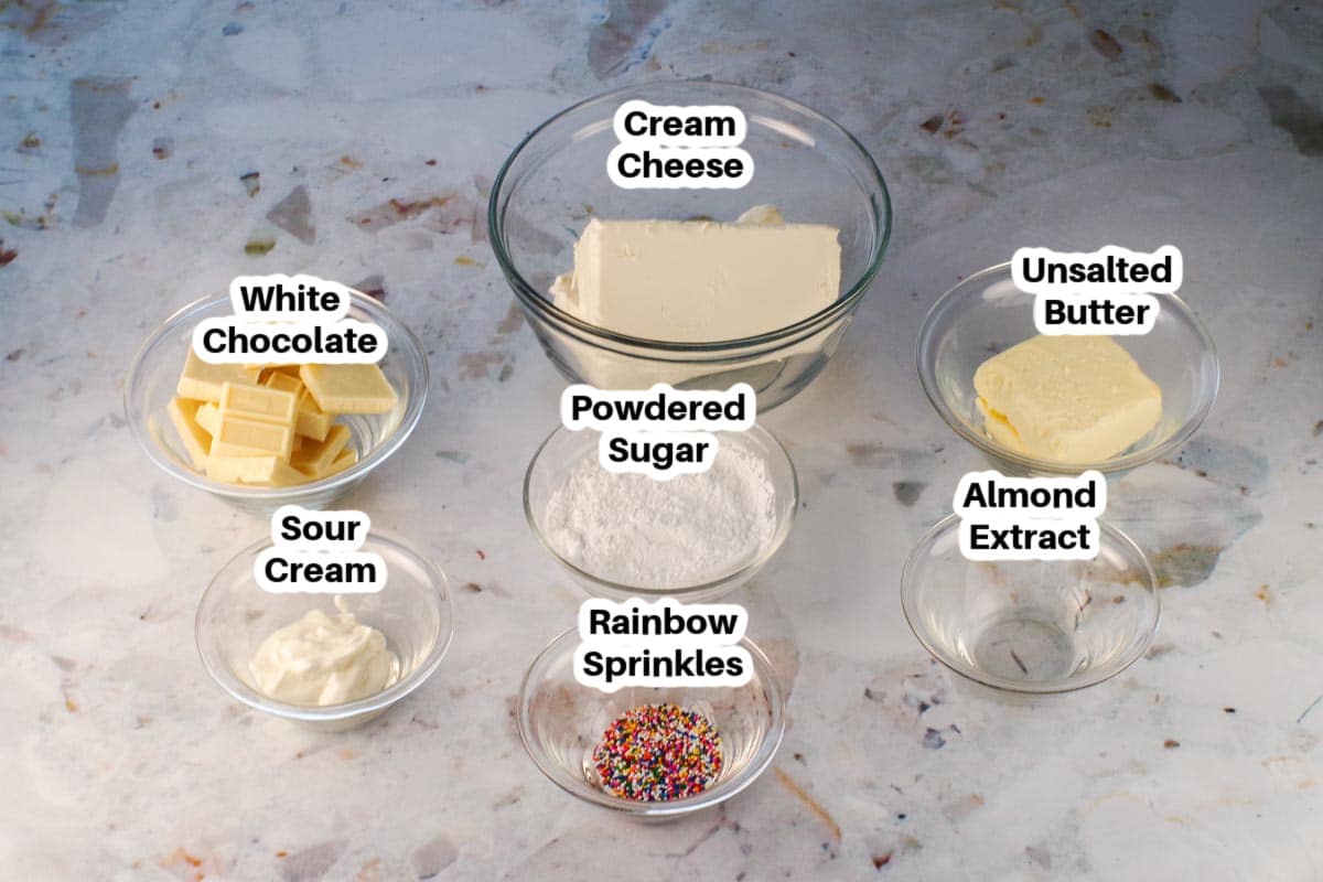 Ingredients needed for Red Velvet Ice Cream Cake Frosting in glass bowls, labelled.